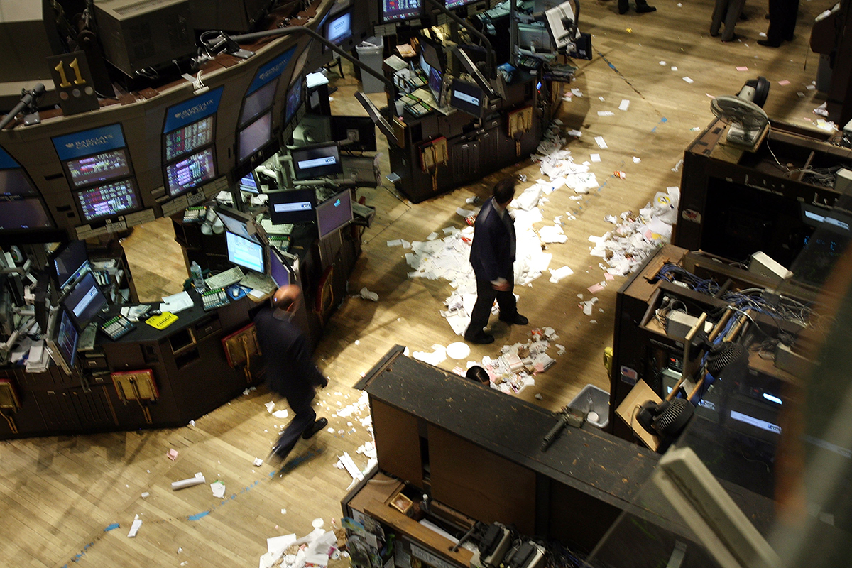 Traders work on the floor of the New York Stock Exchange after the closing bell on Sept. 29, 2008. At the time, the Dow recorded its biggest closing drop in history, falling 777 points.  (Spencer Platt/Getty Images)